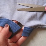 Locate a corner of the collar near the seam and make a cut straight through, stopping when you've cut through the collar.